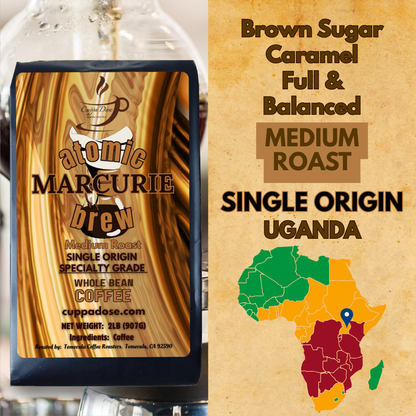 Coffee bag with 'atomic MARCURIE' branding and single origin coffee information on a brown background with Africa map.